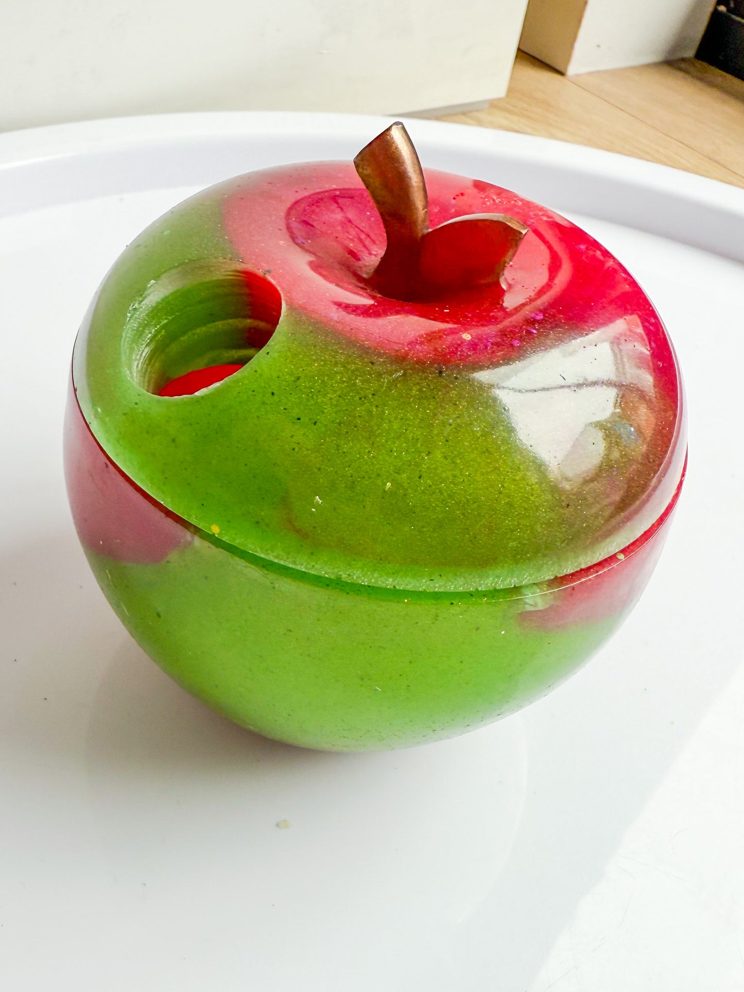 Apple trinket with worm hole
