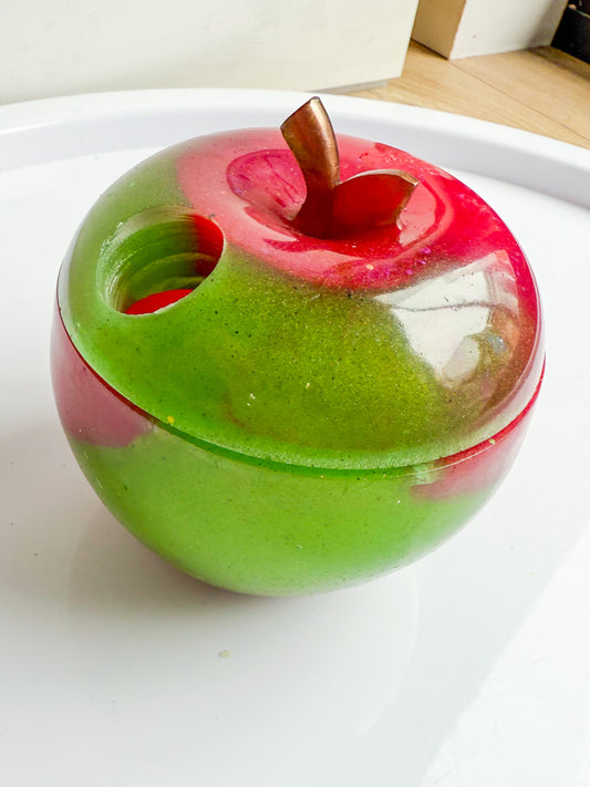 Apple trinket with worm hole